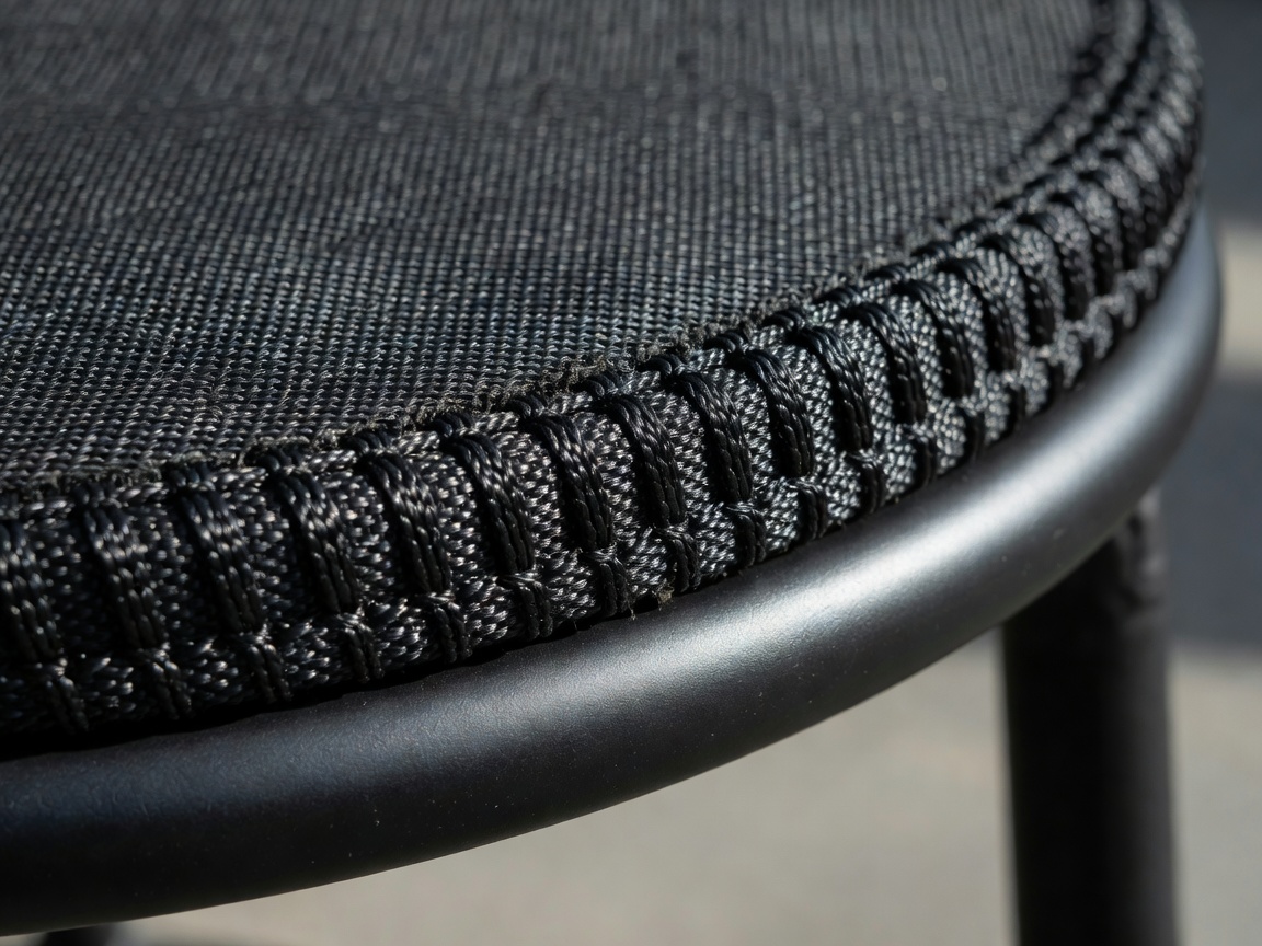 Detail of the robust stitching holding a rebounder mat to its frame